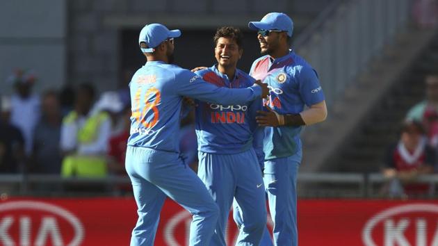 Manchester : India's Kuldeep Yadav, centre, celebrates taking the wicket of England's Joe Root during the Twenty20 cricket match between England and India at Old Trafford cricket ground in Manchester.(AP)