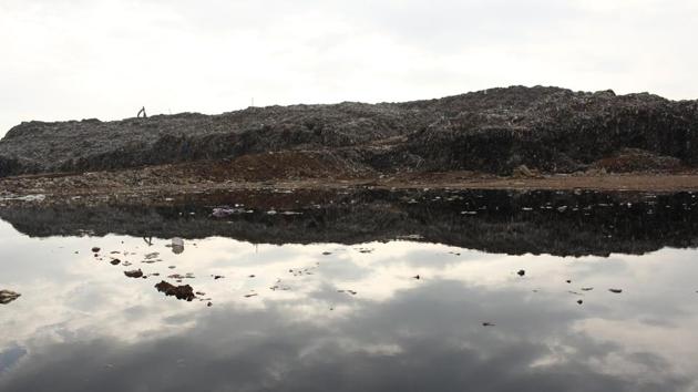 The WTE site which has been contaminated with leachate from the landfill. Environment analyst Chetan Agarwal expressed scepticism about the plant. The site lies upstream from Gurugram, and contaminants found in the leachate move toward the city at the pace of half or one metre a day.“Soon, areas along the Golf Course Road Extension will face the same predicament that the residents of Bandhwari are going through now,” he said. (Yogendra Kumar / HT Photo)