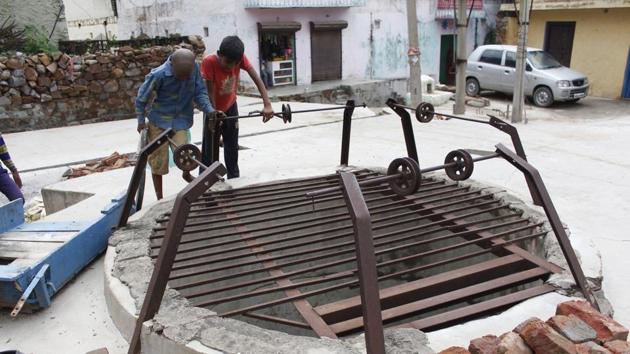 “At one point, the water from our wells used to be sweet. Now, we cannot drink it anymore,” said Lala Ram, resident of Bandhwari. A primary reason for the contamination of groundwater is improper waste management inside the landfill. Activist Vivek Kamboj explained that the landfill is in direct contact with the soil, which would allow the leachate to percolate into the ground. (Yogendra Kumar / HT Photo)