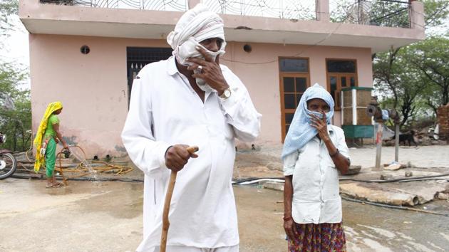 Dharampal, 70, a resident of Bandhwari village suffers from chronic respiratory distress, which he said is because of the degrading air quality in the region. While the leachate contamination has irreversibly polluted the water table, high quantities of methane released from the unsegregated waste not only pollute the air but also make the landfill prone to fires. (Yogendra Kumar / HT Photo)