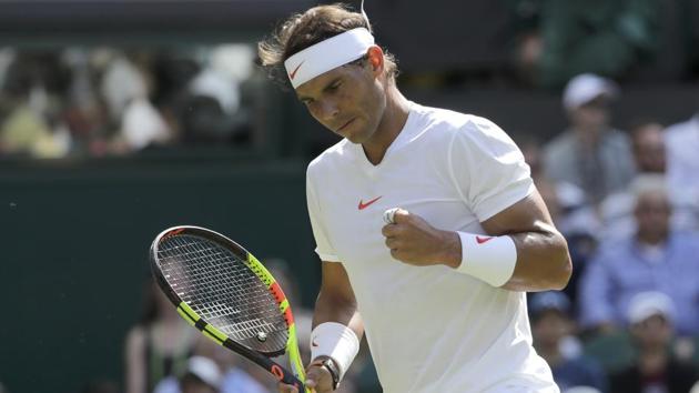 Rafael Nadal celebrates after winning a point during his Wimbledon match against Dudi Sela on Tuesday.(AP)