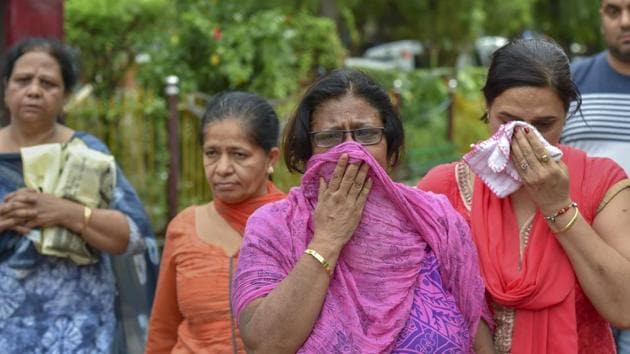 Burari deaths case: Relatives mourn during cremation of the 11 members of a family, who were found hanging at in their house in Burari, at Nigambodh Ghat in New Delhi on Monday.(PTI Photo)