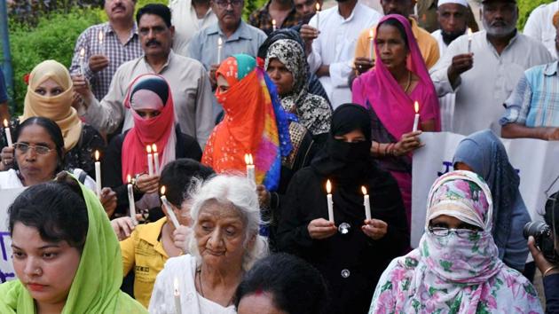 People protest against the rape of an eight-year-old girl in Mandsaur, in Bhopal. (PTI File Photo) People protest against the rape of an eight-year-old girl in Mandsaur, in Bhopal. (PTI File Photo)