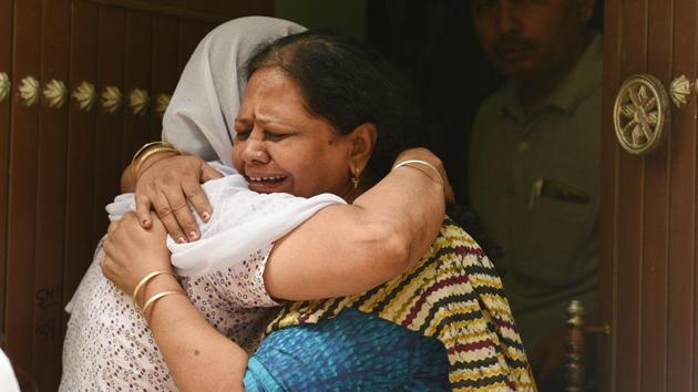 Relatives mourn outside the house, where eleven members of a family were found dead inside their home in north Delhi’s Sant Nagar near Burari on Sunday morning.(Raj K Raj/HT PHOTO)