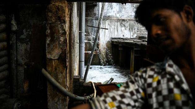 A water treatment area is pictured in an ice factory. The process of making these slabs is anything but state-of-the-art. The first step involves workers filling up large rectangular containers, a bit rusty on the outside, with filtered water. (Chandan Khanna / AFP) A water treatment area is pictured in an ice factory. The process of making these slabs is anything but state-of-the-art. The first step involves workers filling up large rectangular containers, a bit rusty on the outside, with filtered water. (Chandan Khanna / AFP)
