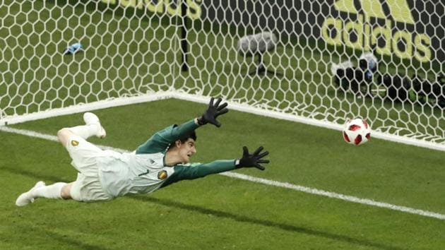 Belgium goalkeeper Thibaut Courtois watches the ball kicked by Japan's Takashi Inui entering in the goal. (AP) Belgium goalkeeper Thibaut Courtois watches the ball kicked by Japan's Takashi Inui entering in the goal. (AP)