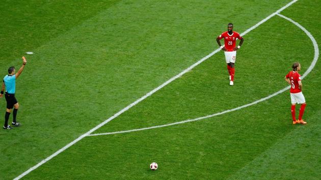 Switzerland's Michael Lang is shown a red card by referee Damir Skomina. (REUTERS) Switzerland's Michael Lang is shown a red card by referee Damir Skomina. (REUTERS)