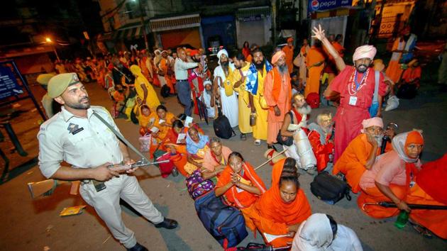 A security person stands guard as pilgrims wait after Amarnath Yatra was suspended due to bad weather, in Jammu. (PTI Photo) A security person stands guard as pilgrims wait after Amarnath Yatra was suspended due to bad weather, in Jammu. (PTI Photo)