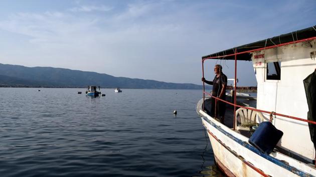 Fisherman Stelios Didonis, stands onboard his boat ‘Panagiotis’, two days before it is destroyed, at the port town of Stavros. Squeezed by an economic crisis which has sapped salaries and pensions and left a fifth of adult Greeks jobless, many fishermen have found the compensation too tempting to ignore. (Alexandros Avramidis / REUTERS)