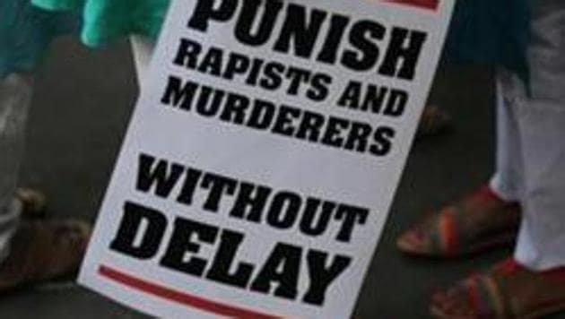 A protestor stands with a placard during a protest in New Delhi against two rape cases on Saturday, May 5, 2018 (Representative Photo) (AP File) A protestor stands with a placard during a protest in New Delhi against two rape cases on Saturday, May 5, 2018 (Representative Photo) (AP File)