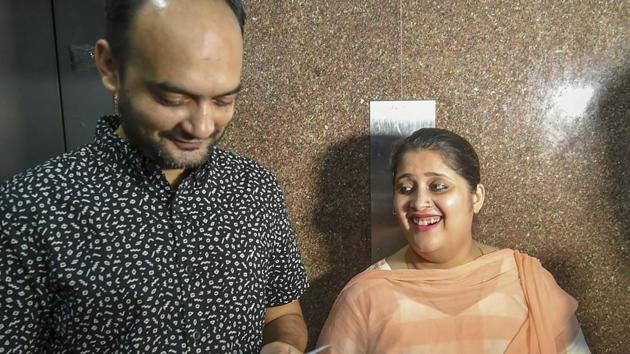 Mohammad Anas Siddiqui and Tanvi Seth show their passports issued to them by the Regional Passport Office in Lucknow on June 21, 2018. Siddiqui and Seth alleged they were humiliated by passport officer Vikas Mishra who rejected their application because they were an inter-faith couple.(PTI)