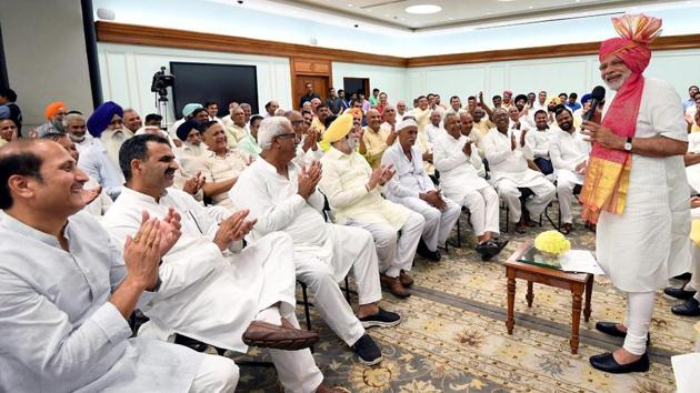 Prime Minister Narendra Modi interacting with a group of sugarcane farmers, at Lok Kalyan Marg, in New Delhi on June 29, 2018.(PTI Photo)