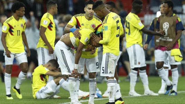 Colombian players console each others at the end of the round of 16 match against England. (AP)