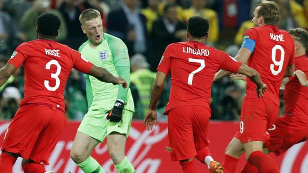 England goalkeeper Jordan Pickford celebrates with teammates after winning the FIFA World Cup 2018 Round of 16 match against Colombia on Tuesday.(AP)