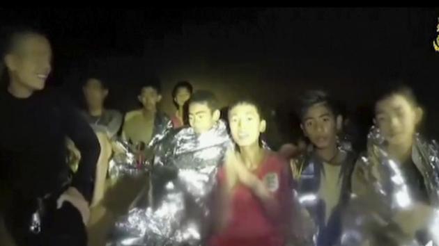 Image taken from a video provided by the Thai Navy Seal shows the boys with Navy SEALs inside the cave. The video electrified Thailand and paved the way for an astonishing rescue. The first visuals of the “Wild Boar” football team and evidence of their survival lit up a country that has followed every turn in the painstaking rescue that at times looked forlorn. (AP)