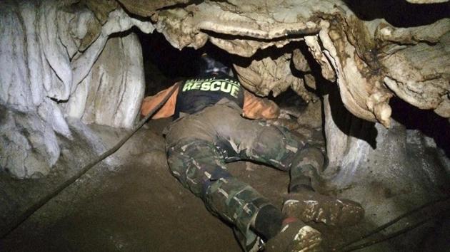 Thailand Department of National Parks and Wildlife rescue personnel search for alternate entrances. Interior Minister Anupong Paojinda said as a result of the forecast, the boys may need to swim out using diving gear. He said they would be brought out via the same complicated route through which their rescuers entered but most of the boys can’t swim. (AP)