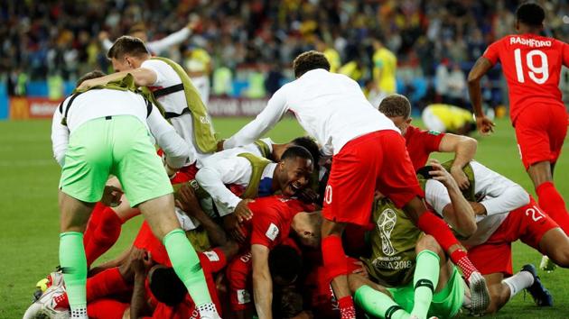 England players celebrate winning the penalty shoot-out. (REUTERS)