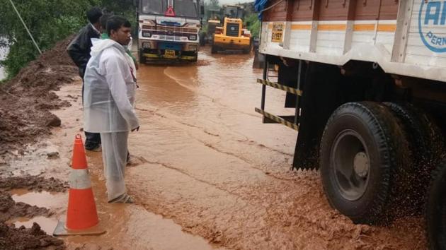 A massive traffic jam was reported on the Mumbai-Goa highway near Mahad in Maharashtra’s Raigad district on Thursday morning after the busy road was blocked by a landslide following heavy rains. Traffic snarls stretched up to 5km on both Mumbai and Goa-bound carriageways. (HT Photo)
