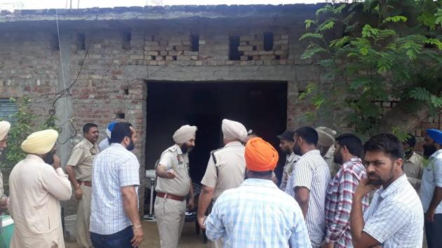 Police personnel examining the house where the three women were found murdered on Thursday.(HT Photo) Police personnel examining the house where the three women were found murdered on Thursday.(HT Photo)
