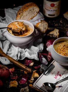 French Onion Soup at Artisan, Sofitel Mumbai BKC is a slow cooked broth served in a crock with bubbling cheese on toasted French bread, which hangs over the edges and sticks to the outer side of the crock French Onion Soup at Artisan, Sofitel Mumbai BKC is a slow cooked broth served in a crock with bubbling cheese on toasted French bread, which hangs over the edges and sticks to the outer side of the crock