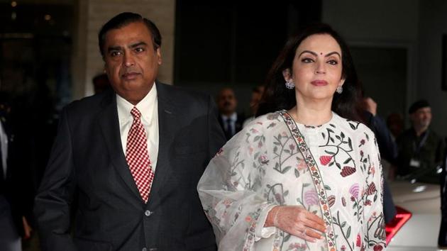 Mukesh Ambani, Chairman and Managing Director of Reliance Industries, arrives with his wife Nita Ambani to address the company's annual general meeting in Mumbai on July 5. (REUTERS) Mukesh Ambani, Chairman and Managing Director of Reliance Industries, arrives with his wife Nita Ambani to address the company's annual general meeting in Mumbai on July 5. (REUTERS)