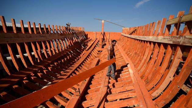 Dimitris Ioannou, 30, works on a wooden tourist boat at his family’s traditional shipyard at the port town of Ierissos. The crisis has had a knock-on effect on traditional shipbuilders. “They want to stop (over) fishing to protect the sea. But destroying boats will destroy us as well. So I think they are not doing something right,” shipbuilder Yannis Prasinos said. (Alexandros Avramidis / REUTERS)