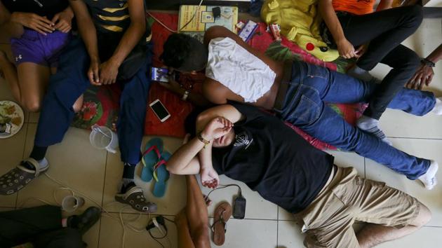 Anti-government students rest inside the university. The conflict began in mid-April when protesters were attacked for marching against cuts to social security pensions. Students responded en masse and have continued blockading streets and marching against the government for more than two months. (Esteban Felix / AP)