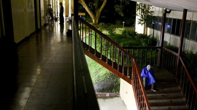 A masked student rests on a stairwell. The students holed up here have masked their identities for protection. The government dismisses them as delinquents and says police have to respond when students disrupt traffic. (Esteban Felix / AP)