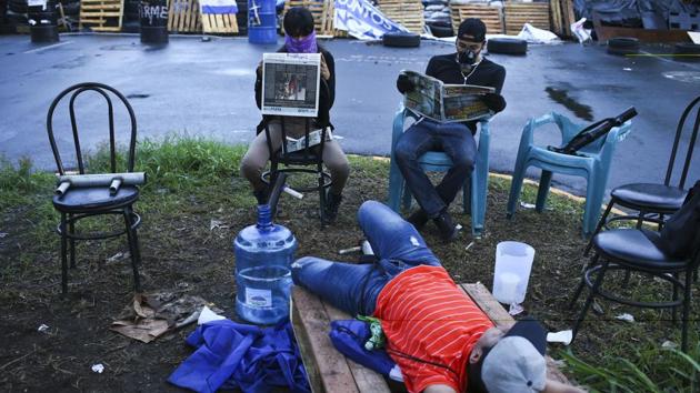 Where they once arranged their lives around a class schedule, students at the Autonomous University of Nicaragua now organize themselves around watch schedules, always keeping an eye on their adversaries: the Nicaraguan government and allied youth groups. (Esteban Felix / AP)