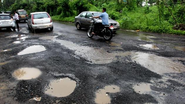 Potholes at Saket road ,India, on Wednesday, July 04, 2018(HT Photo)