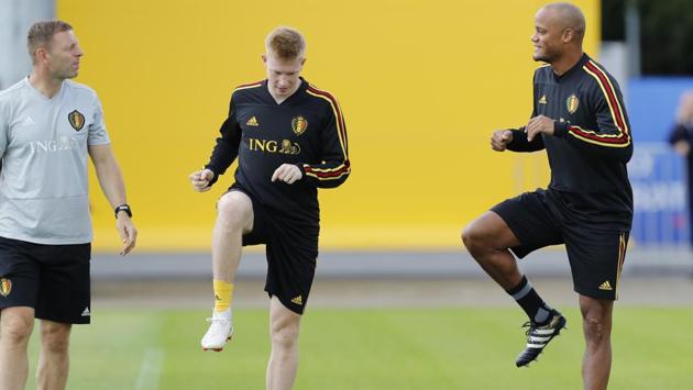 Belgium's Vincent Kompany (R) and Kevin de Bruyne warm up at the Guchkovo Stadium in Dedovsk, outside Moscow, on Thursday. (AP)