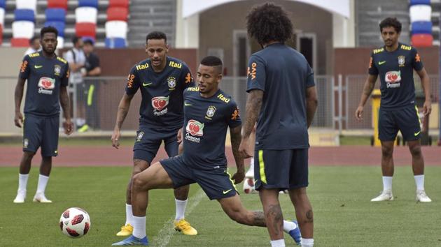 Brazil's Gabriel Jesus (C) is watched by Neymar as he controls the ball during a training session. Brazil and Uruguay are the only two non-European and South American teams left in the tournament. (AP)