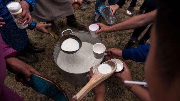 Followers of shamanism take milk to be thrown in the air as an offering before the fire ritual. Also known as galiin tahilga, the fire ritual is a multi-purpose ritual that is meant to bring blessings or heal someone at a remote location. (Kevin Frayer / Getty Images) Followers of shamanism take milk to be thrown in the air as an offering before the fire ritual. Also known as galiin tahilga, the fire ritual is a multi-purpose ritual that is meant to bring blessings or heal someone at a remote location. (Kevin Frayer / Getty Images)
