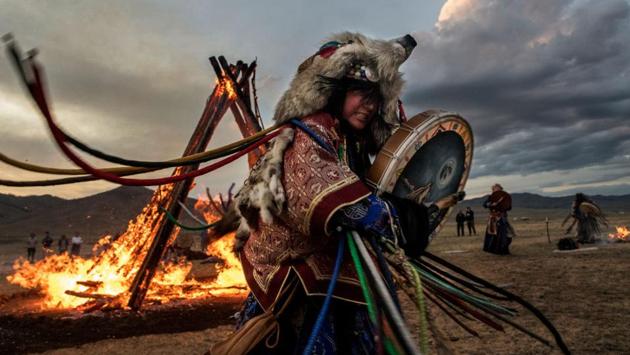 Continuing drumming, a state of ecstasy is reached where the shamans experience altered consciousness. Shamans, it is believed, are chosen by their ancestral spirits to serve as a bridge to the living world; a conduit to provide healing, knowledge, and advice. (Kevin Frayer / Getty Images) Continuing drumming, a state of ecstasy is reached where the shamans experience altered consciousness. Shamans, it is believed, are chosen by their ancestral spirits to serve as a bridge to the living world; a conduit to provide healing, knowledge, and advice. (Kevin Frayer / Getty Images)