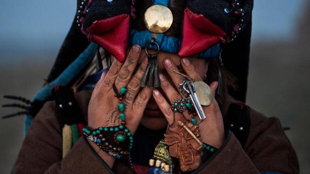 A Mongolian Shaman or Buu, prays during a ceremony outside Ulaanbaatar at sunrise. Banned for 70 years under Communist rule, shamanism has seen resurgence in Mongolia since 1992, when the ancient practice became protected under the constitution. This folk religion dates back as far back as the region’s recorded history. (Kevin Frayer / Getty Images) A Mongolian Shaman or Buu, prays during a ceremony outside Ulaanbaatar at sunrise. Banned for 70 years under Communist rule, shamanism has seen resurgence in Mongolia since 1992, when the ancient practice became protected under the constitution. This folk religion dates back as far back as the region’s recorded history. (Kevin Frayer / Getty Images)