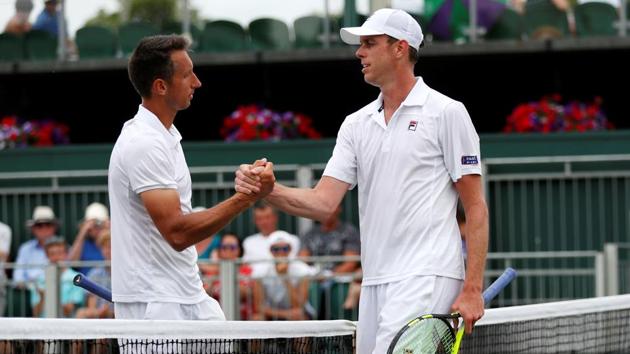 Sam Querrey of the U.S. shakes hands with Ukraine's Sergiy Stakhovsky after defeating him in their second round match. (REUTERS)