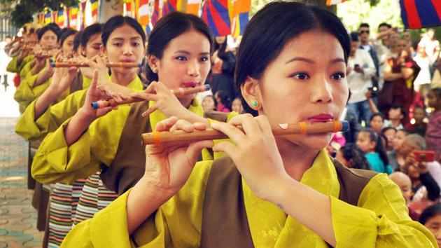 Artists play flutes as they perform at a temple in McLeodganj. (PTI)
