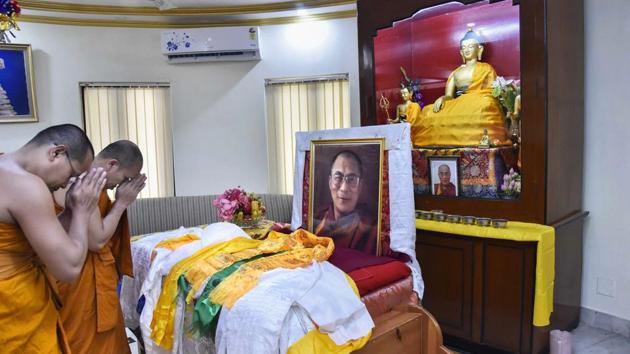 Buddhist monks from Thailand offer prayers on the 83rd birthday of 14th Dalai Lama Tenzin Gyatso, at Bodh Gaya on Friday. Born on July 6, 1935, in northeastern Tibet, the Dalai Lama was recognised at the age of two as the reincarnation of the 13th Dalai Lama, Thubten Gyatso. (PTI)