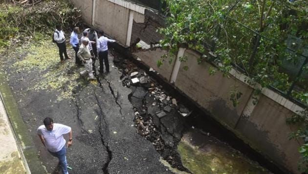 Only a part of the compound wall has caved in as of now.(Pratik Chorge/HT Photo)