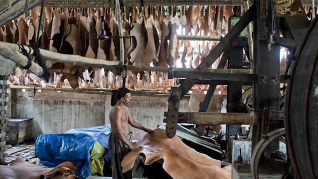 Turning cow hides into soft leather can be a dirty business, and in Hazaribagh, the former home to more than 150 tanneries, the air a year ago was so noxious with chemicals and rotting trimmings that it was repeatedly listed among the most polluted places on earth. The adjacent Buriganga River, a source of drinking water for 180,000 people, was considered poisoned. (A.M Ahad / AP) Turning cow hides into soft leather can be a dirty business, and in Hazaribagh, the former home to more than 150 tanneries, the air a year ago was so noxious with chemicals and rotting trimmings that it was repeatedly listed among the most polluted places on earth. The adjacent Buriganga River, a source of drinking water for 180,000 people, was considered poisoned. (A.M Ahad / AP)