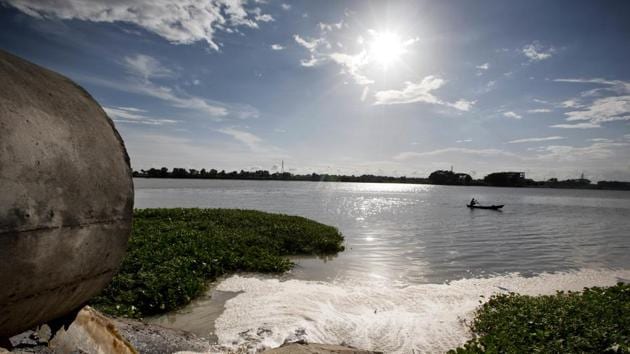 In addition to delayed operations at the effluent treatment plant, a new problem has started: repeated breaches in the embankment of a pond where solid waste is supposed to be held. This is allowing more pollution — mixed with rainwater — to flow into the river. (A.M Ahad / AP) In addition to delayed operations at the effluent treatment plant, a new problem has started: repeated breaches in the embankment of a pond where solid waste is supposed to be held. This is allowing more pollution — mixed with rainwater — to flow into the river. (A.M Ahad / AP)