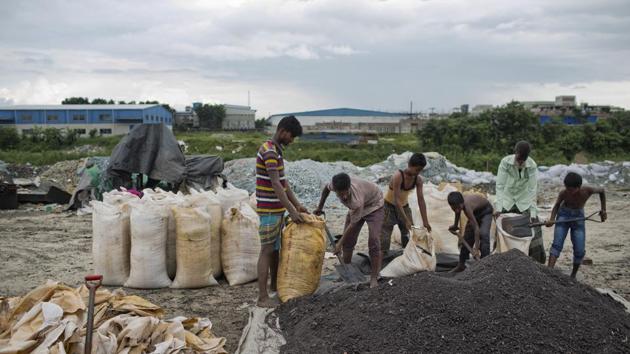 Labourers work on burnt scraps of leather that will be processed as feed. “This is worrying. The embankment has been repaired repeatedly, but because of the monsoon, the breaches developed again,” said Delowar Hossain, a plant consultant. (A.M Ahad / AP) Labourers work on burnt scraps of leather that will be processed as feed. “This is worrying. The embankment has been repaired repeatedly, but because of the monsoon, the breaches developed again,” said Delowar Hossain, a plant consultant. (A.M Ahad / AP)