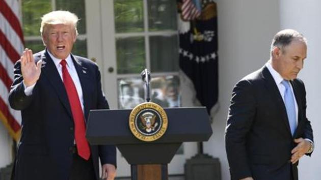 Scott Pruitt (right), a fervent climate-change sceptic, was instrumental in rolling back the Obama-era environmental regulations which, according to the Republican Party and President Donald Trump, were stifling American manufacturing and industries such as coal mining.(AFP/File Photo)