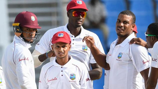 Kieran Powell (from left), Shane Dowrich, Jason Holder and Shannon Gabrielof West Indies celebrate the dismissal of Mominul Haque of Bangladesh during day 2 of the 1st Test at Sir Vivian Richards Cricket Ground, North Sound.(AFP)