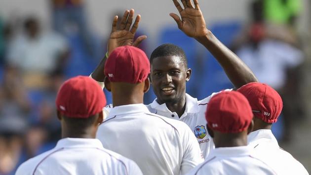West Indies celebrate a wicket on day 2 of the 1st Test between West Indies and Bangladesh at Sir Vivian Richards Cricket Ground, North Sound, Antigua.(AFP)