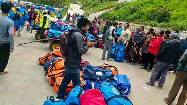 Indian pilgrims being evacuated from Simikot to Surkhet and Nepalganj, as authorities stepped up efforts to rescue those stranded there due to heavy rain while returning from the Kailash Mansarovar pilgrimage in Tibet in Simikot on Thursday.(PTI Photo)