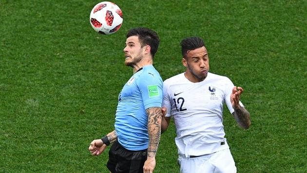 Uruguay's midfielder Nahitan Nandez (L) vies for the header with France's midfielder Corentin Tolisso. (AFP)