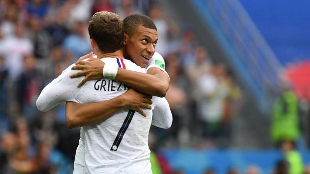 France's forward Antoine Griezmann (L) celebrates his goal with France's forward Kylian Mbappe. (AFP)