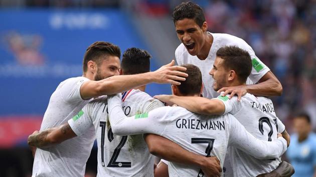 France's forward Antoine Griezmann (2ndR) celebrates with teammates after scoring their second goal. (AFP)