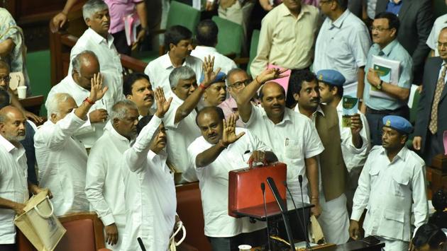 Chief Minister of Karnataka, H D Kumaraswamy, Deputy CM Parmeshwara and other leaders gesture towards media after presenting the state budget in Vidhan Soudha in Bengaluru, on July 5, 2018. (Arijit Sen / HT Photo)